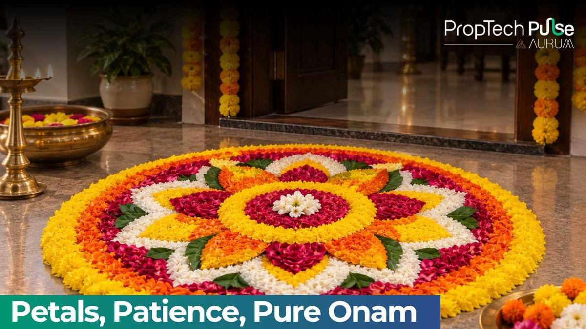Elegant Onam pookalam design made with colourful marigold, rose, and white flower petals at a beautifully decorated home entrance with traditional brass lamps